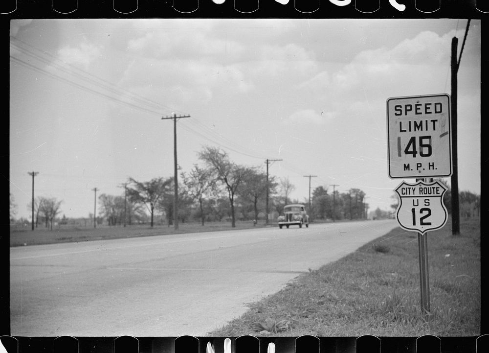 [Untitled photo, possibly related to: Highway through Chicago, Illinois. Sign showing speed limit and U.S. Route No. 12. Two…