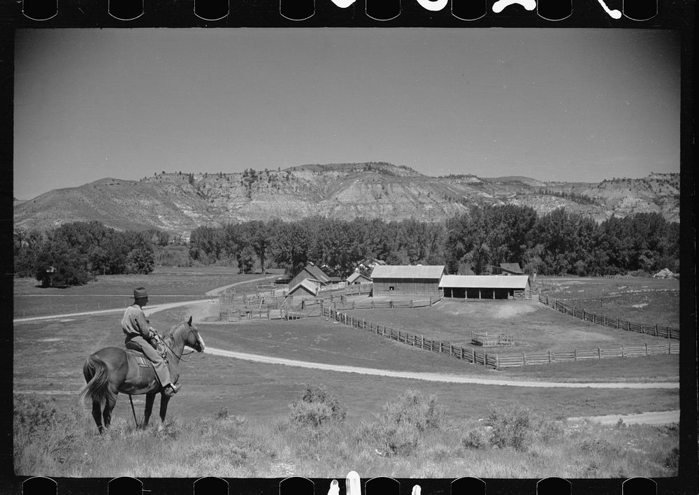 Jack Arnold looking over the Quarter Circle U Ranch which he owns, Rosebud County, Montana. Sourced from the Library of…