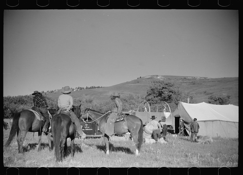 [Untitled photo, possibly related to: Setting up the roundup camp, Quarter Circle U Ranch roundup, Montana]. Sourced from…