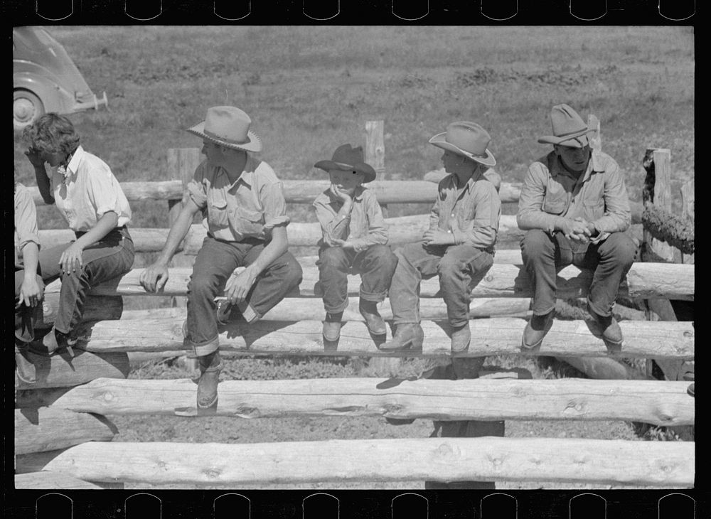 [Untitled photo, possibly related to: Dude girls on a corral fence, Quarter Circle U roundup, Montana]. Sourced from the…