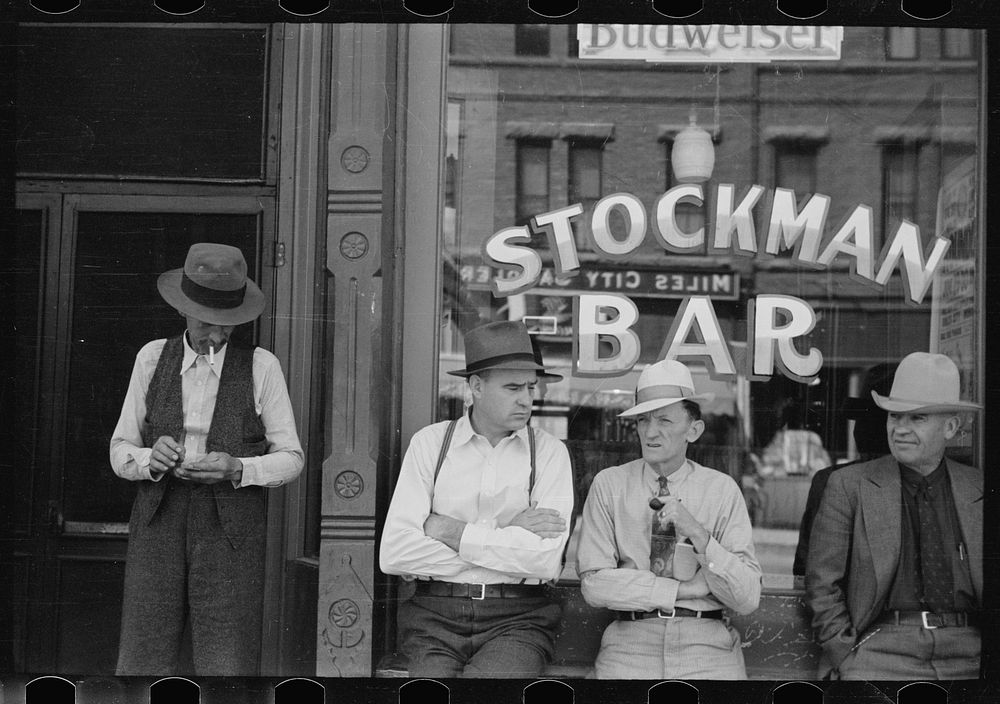 [Untitled photo, possibly related to: Stockmen in front of bar on main street, Miles City, Montana]. Sourced from the…