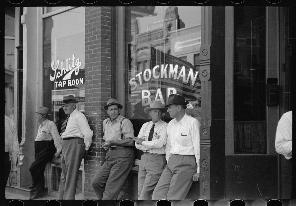 Stockmen in front of bar on main street, Miles City, Montana. Sourced from the Library of Congress.
