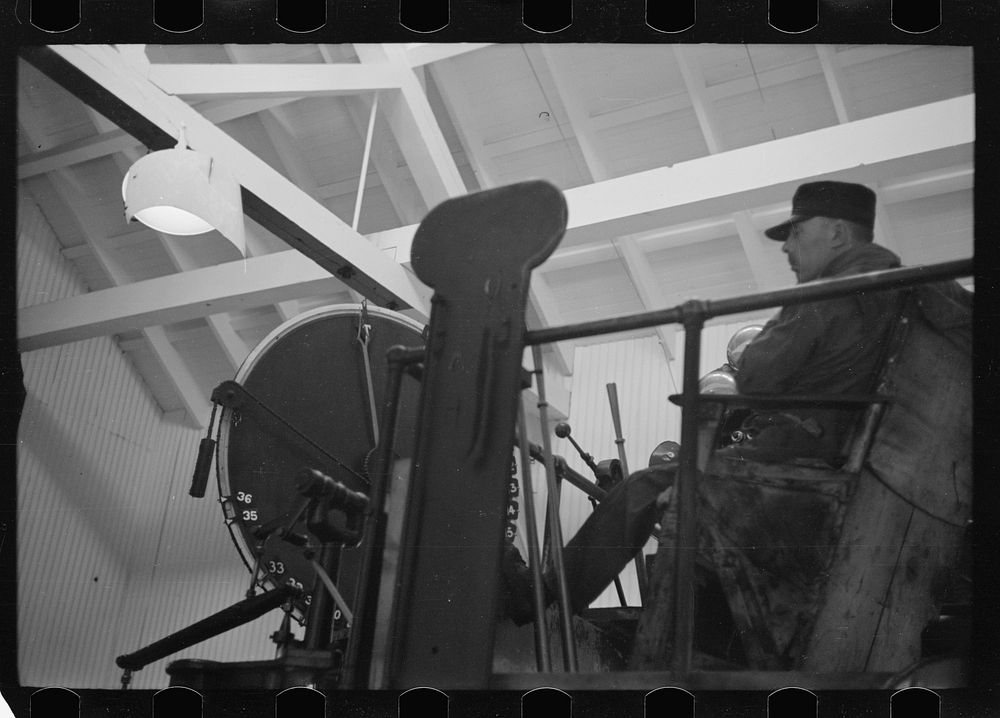 [Untitled photo, possibly related to: Engineer at controls of high-speed hoist which reaches depth of 3800 feet. Copper…