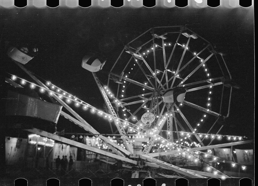 Ferris wheel and amusements at carnival, Bozeman, Montana. Sourced from the Library of Congress.