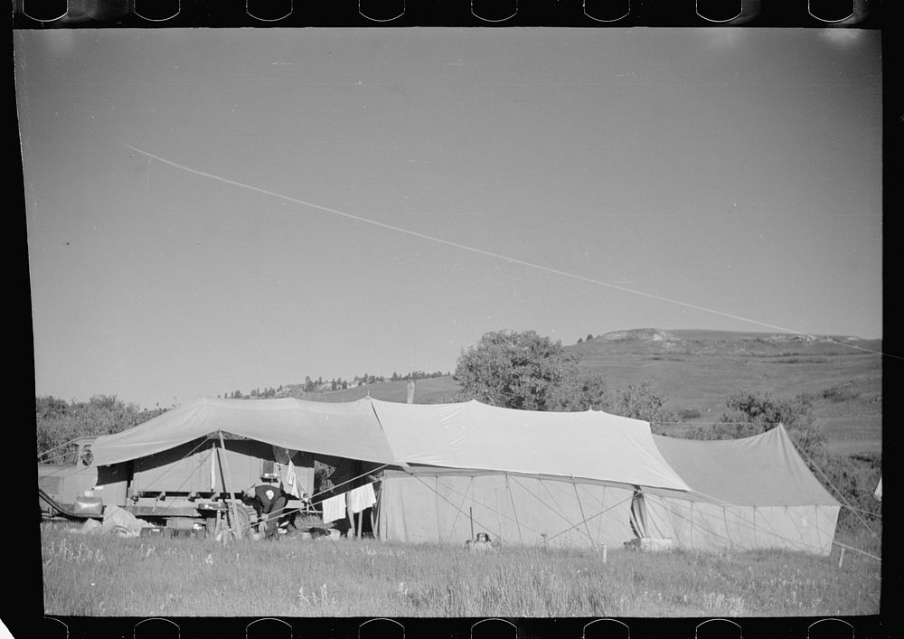 [Untitled photo, possibly related to: Roundup camp, Quarter Circle U roundup, Big Horn County, Montana]. Sourced from the…