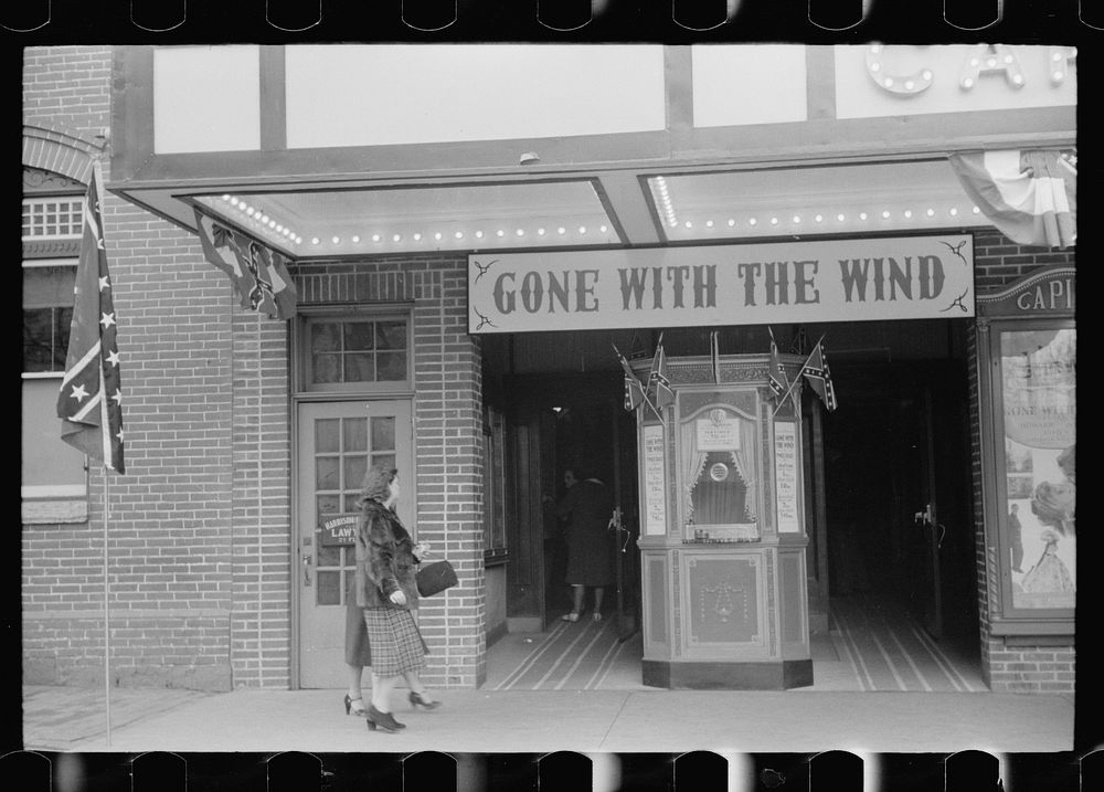 Flags of the Confederacy displayed at movie house on Lincoln's birthday, Winchester, Virginia. Sourced from the Library of…