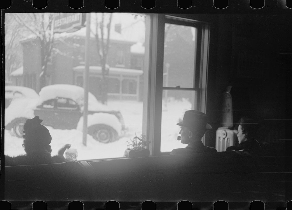 Guests in hotel lobby watching snowstorm, Chillicothe, Ohio. Sourced from the Library of Congress.