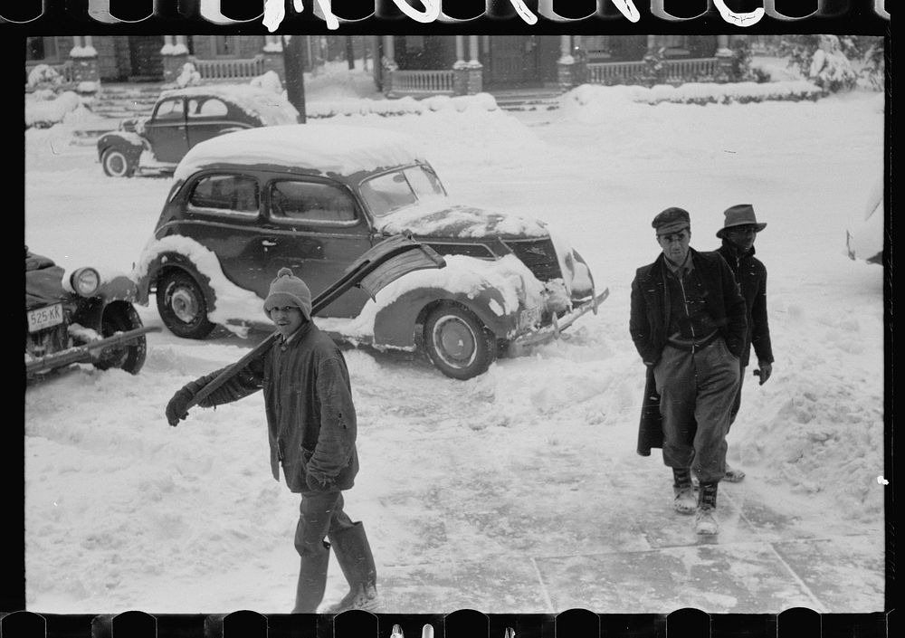 [Untitled photo, possibly related to: Shoveling snow off the sidewalk, Chillicothe, Ohio]. Sourced from the Library of…