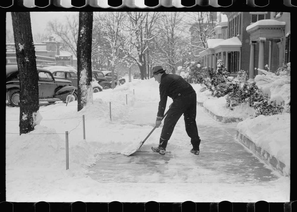 [Untitled photo, possibly related to: Shoveling snow off the sidewalk, Chillicothe, Ohio]. Sourced from the Library of…