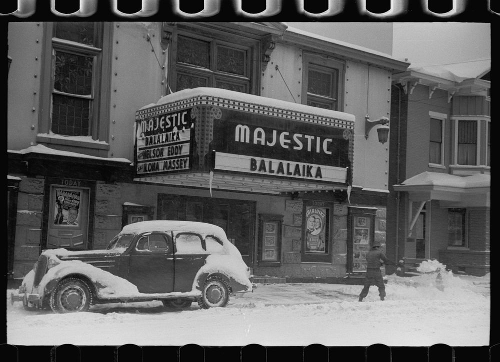 Shoveling snow away from the movie entrance, Chillicothe, Ohio. Sourced from the Library of Congress.