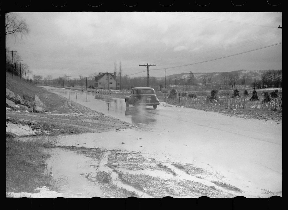 [Untitled photo, possibly related to: Water on highway due to melting snow, Clermont County, Ohio]. Sourced from the Library…