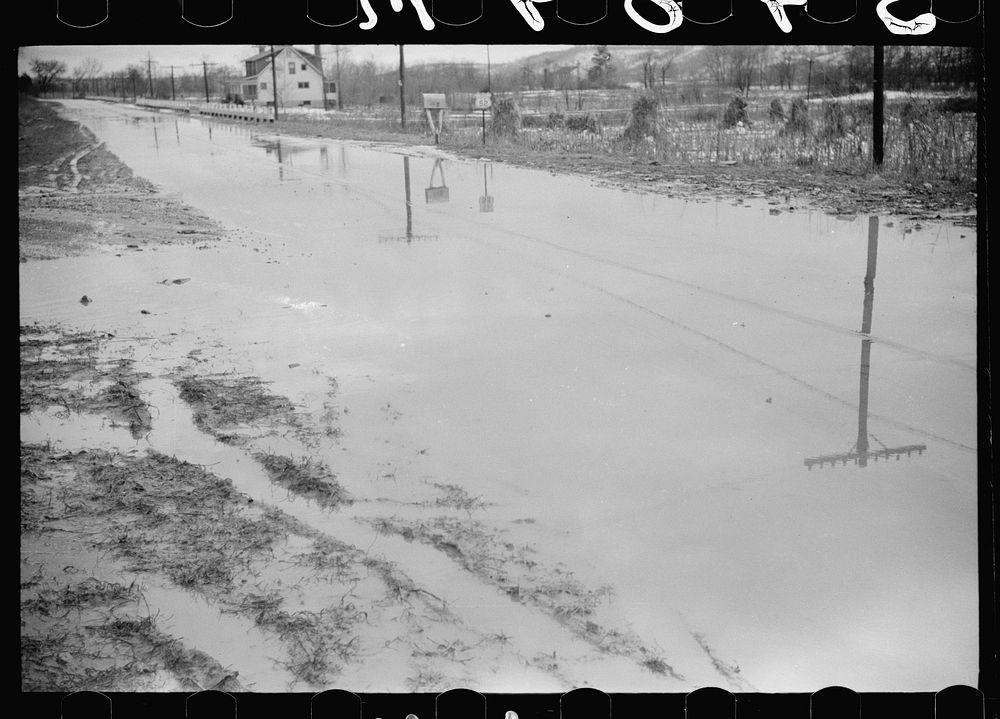 Water on highway due to melting snow, Clermont County, Ohio. Sourced from the Library of Congress.