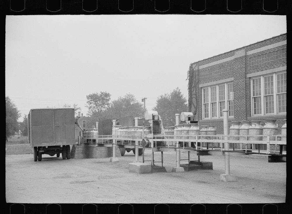[Untitled photo, possibly related to: Unloading a milk truck at pasteurizing plant, Farmington, Minnesota]. Sourced from the…