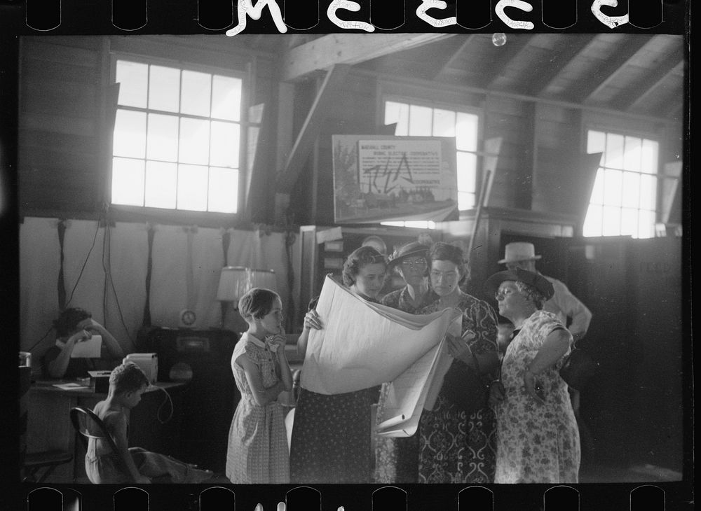 [Untitled photo, possibly related to: Explaining the REA program to farm women, Central Iowa 4-H Club fair, Marshalltown…