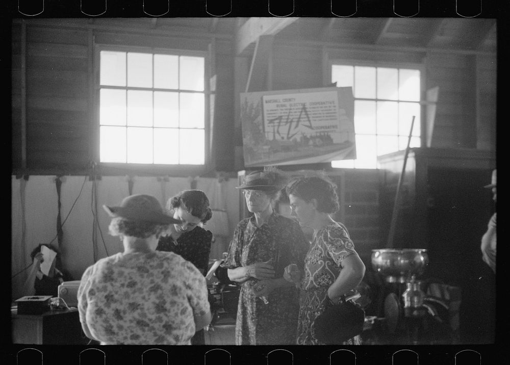 [Untitled photo, possibly related to: Explaining the REA program to farm women, Central Iowa 4-H Club fair, Marshalltown…