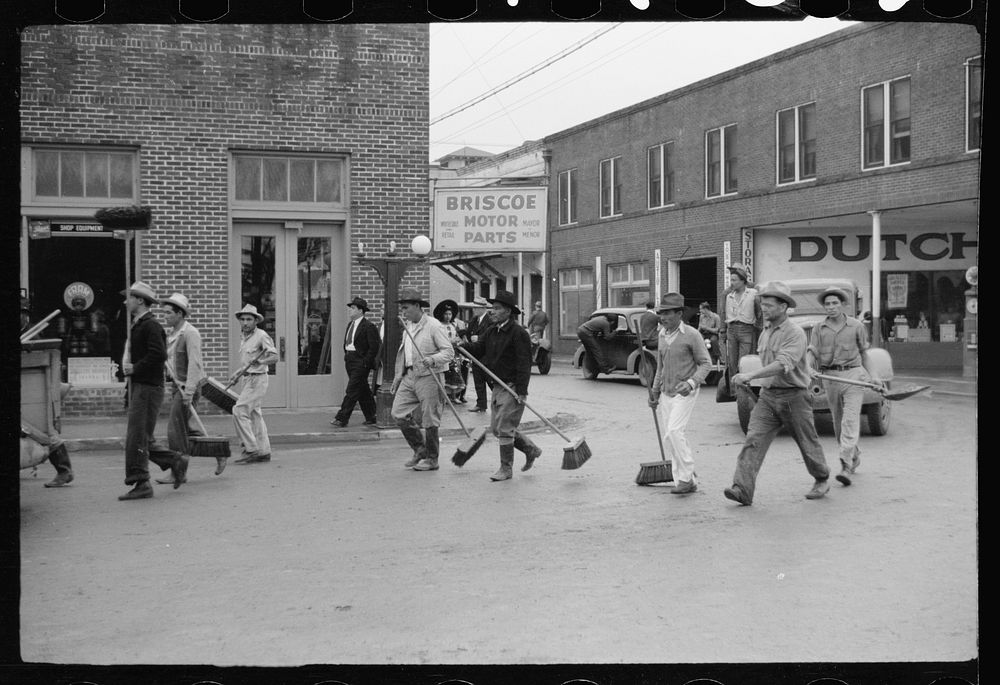 [Untitled photo, possibly related to: Street cleaners follow the parade, Charro Days, Brownsville, Texas]. Sourced from the…