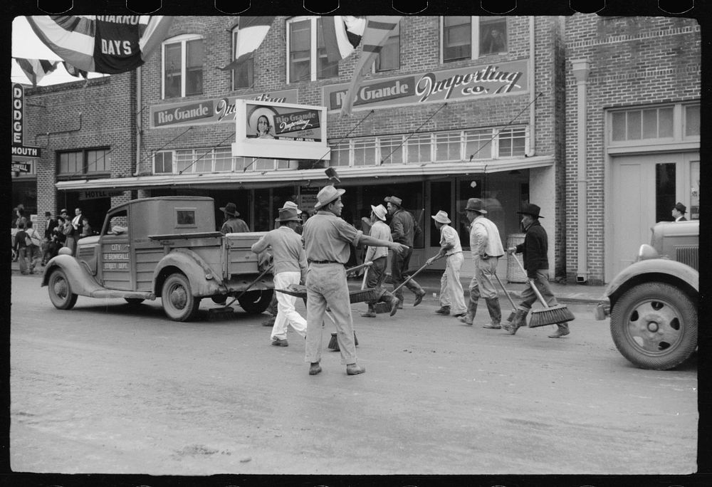 Street cleaners follow the parade, Charro Days, Brownsville, Texas. Sourced from the Library of Congress.