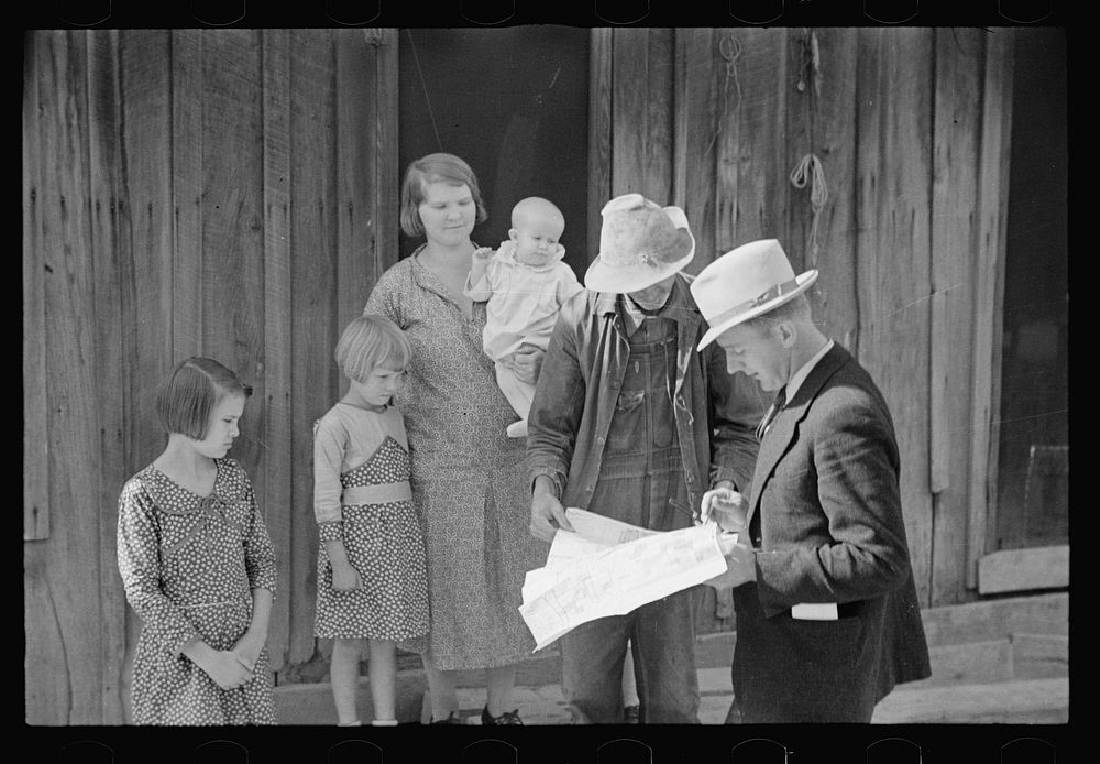 Client talks things over with the government representative, Brown County, Indiana. Sourced from the Library of Congress.