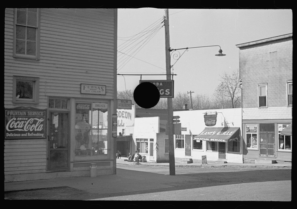 [Untitled photo, possibly related to: Drug store and corner view of Nashville, Brown County, Indiana]. Sourced from the…