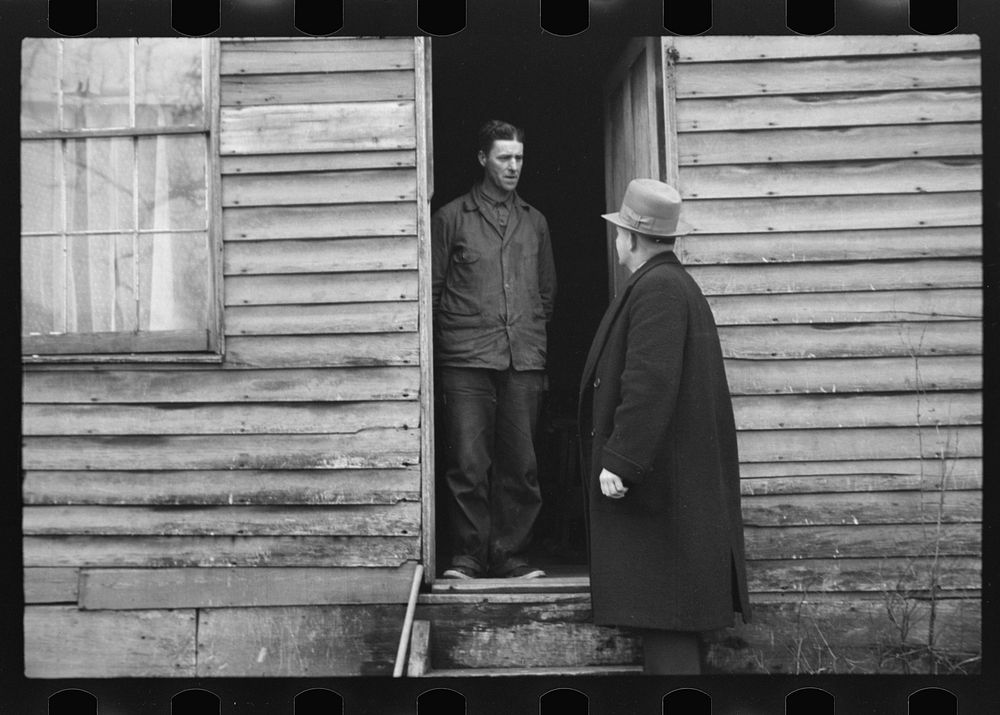 [Untitled photo, possibly related to: Resettlement Administration representative at door of rehabilitation client's house…