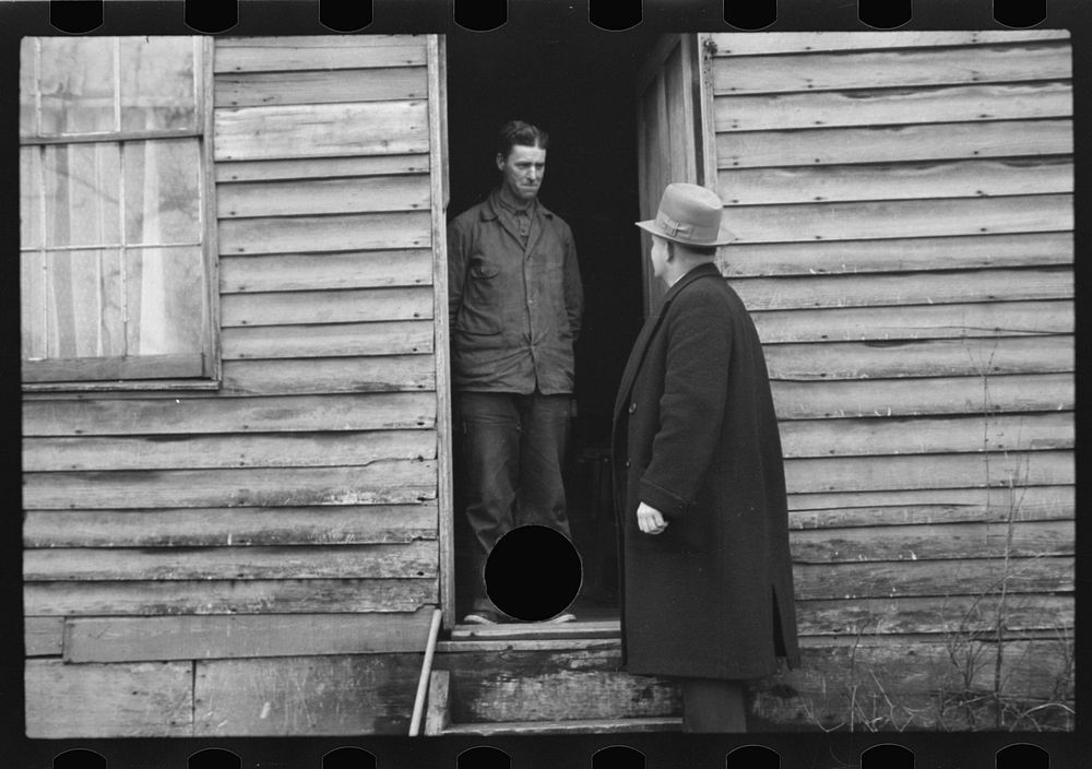 [Untitled photo, possibly related to: Resettlement Administration representative at door of rehabilitation client's house…