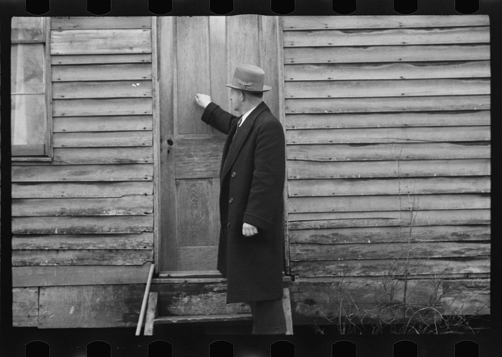 Resettlement Administration representative at door of rehabilitation client's house, Jackson County, Ohio. Sourced from the…