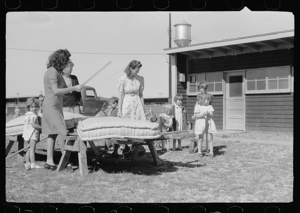[Untitled photo, possibly related to: In front of the community store, FSA (Farm Security Administration) camp, Sinton…