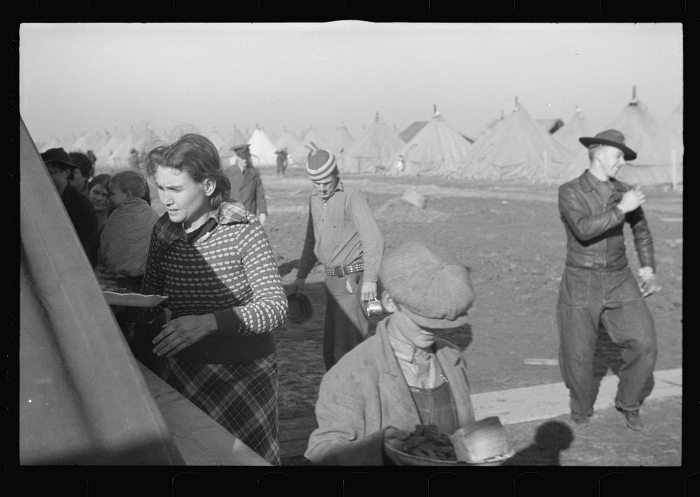 Part of the mess line at mealtime in camp for white flood refugees at Forrest City, Arkansas. Sourced from the Library of…