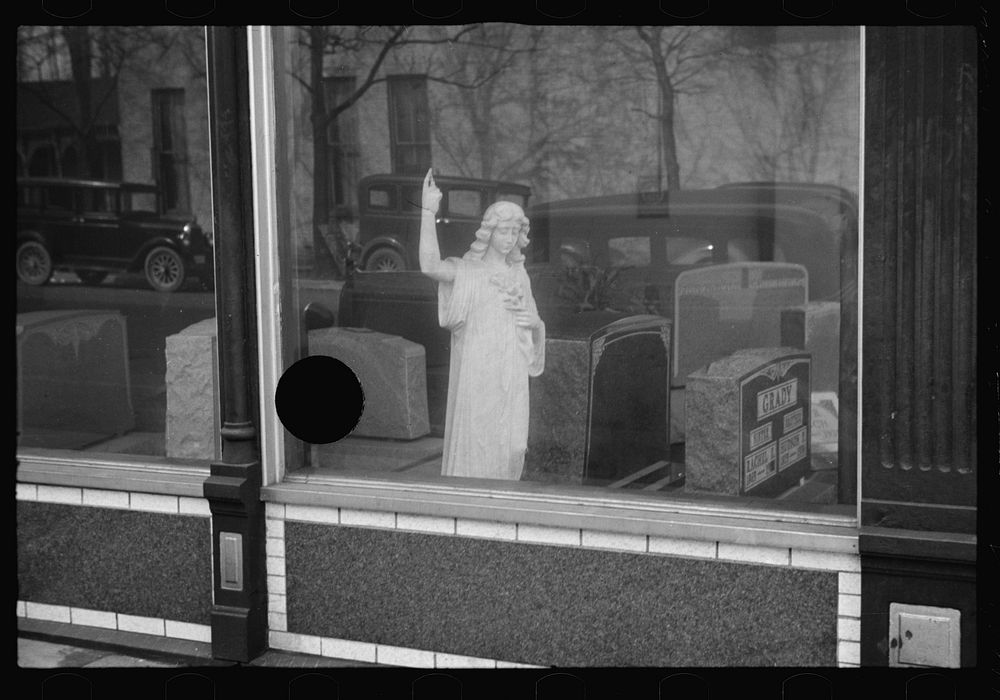 Gravestones and monument in dealer's window, Jackson, Ohio. Sourced from the Library of Congress.