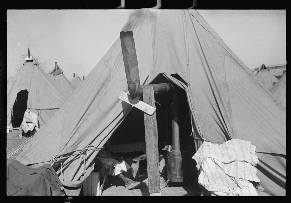 [Untitled photo, possibly related to: A  flood refugee family who, with their rescued household goods have moved into the…