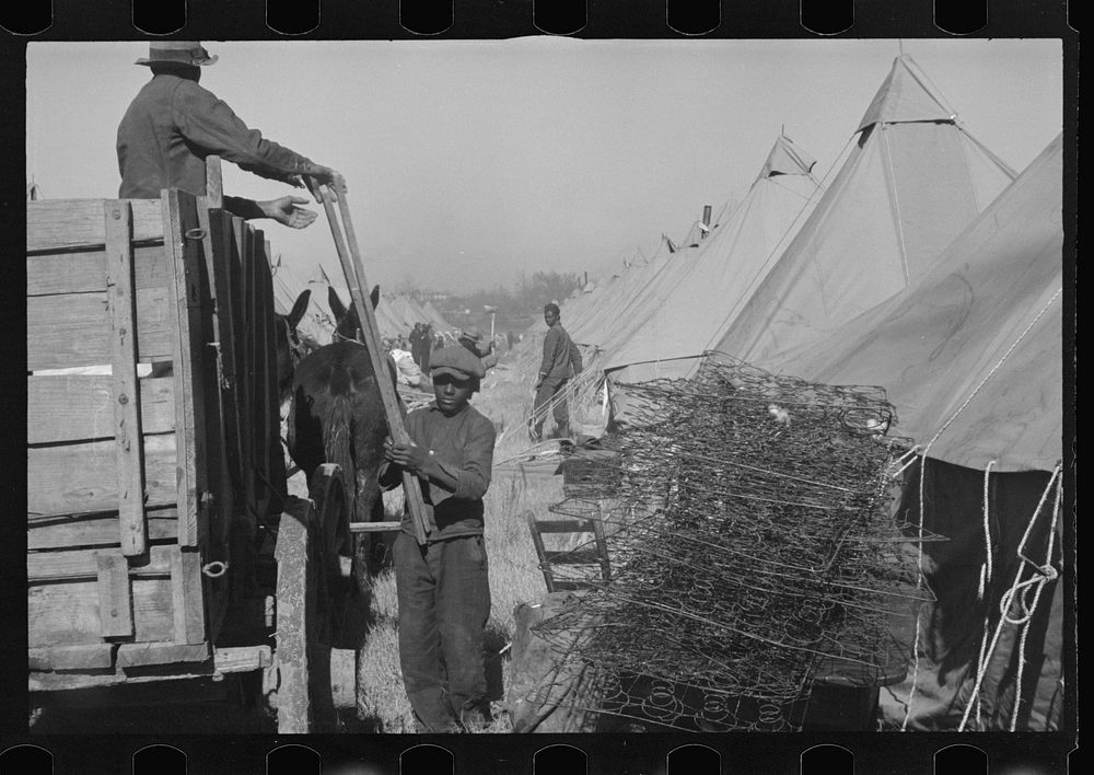 [Untitled photo, possibly related to: A  flood refugee family who, with their rescued household goods have moved into the…