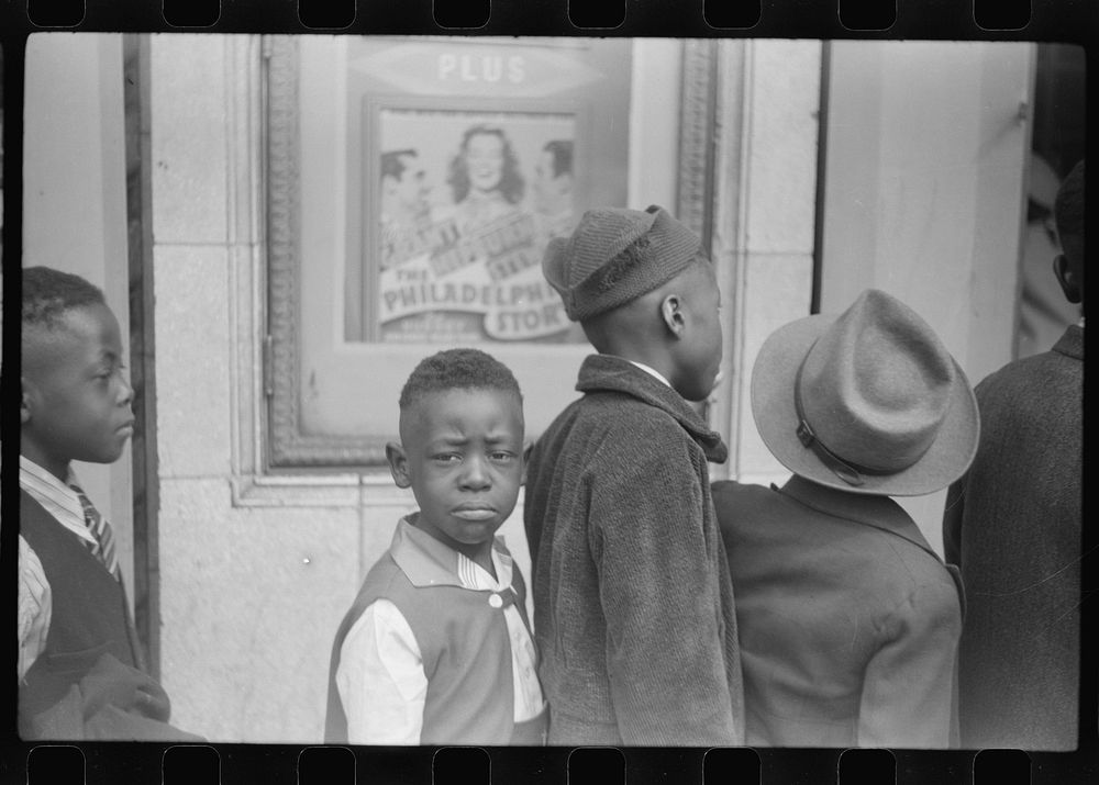 Children in front of moving picture theater, Easter Sunday matinee, Black Belt, Chicago, Illinois. Sourced from the Library…