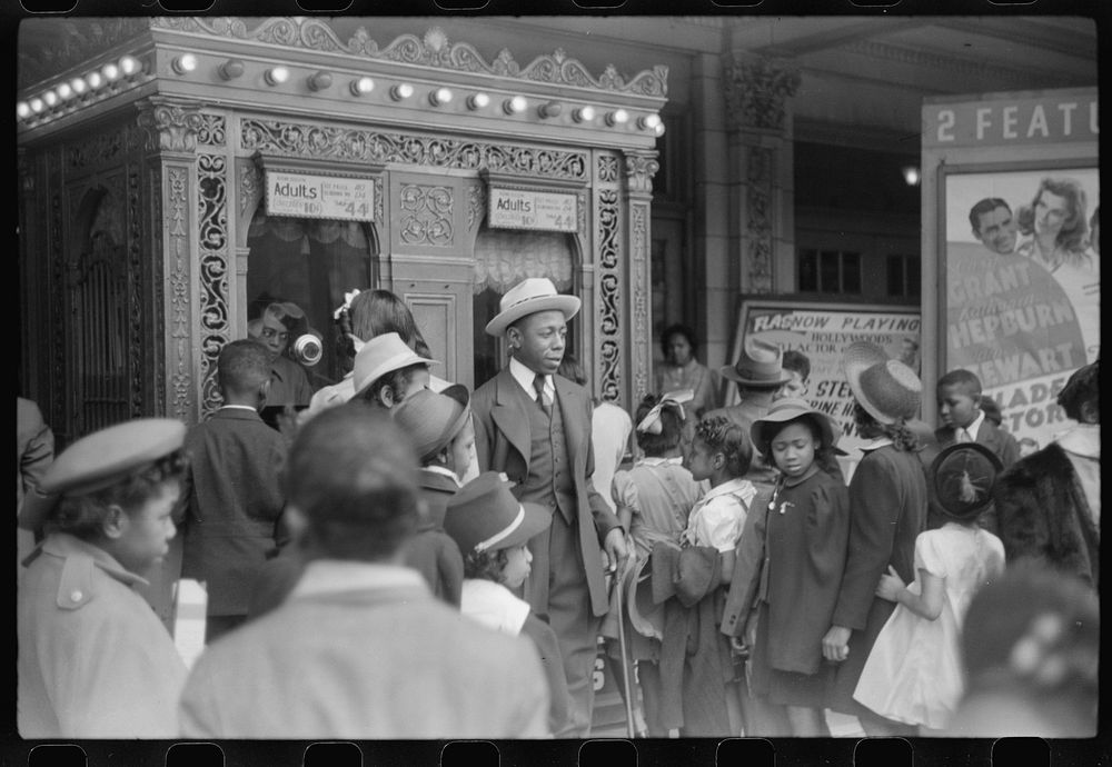 Children in front of moving picture theater, Easter Sunday matinee, Black Belt, Chicago, Illinois. Sourced from the Library…