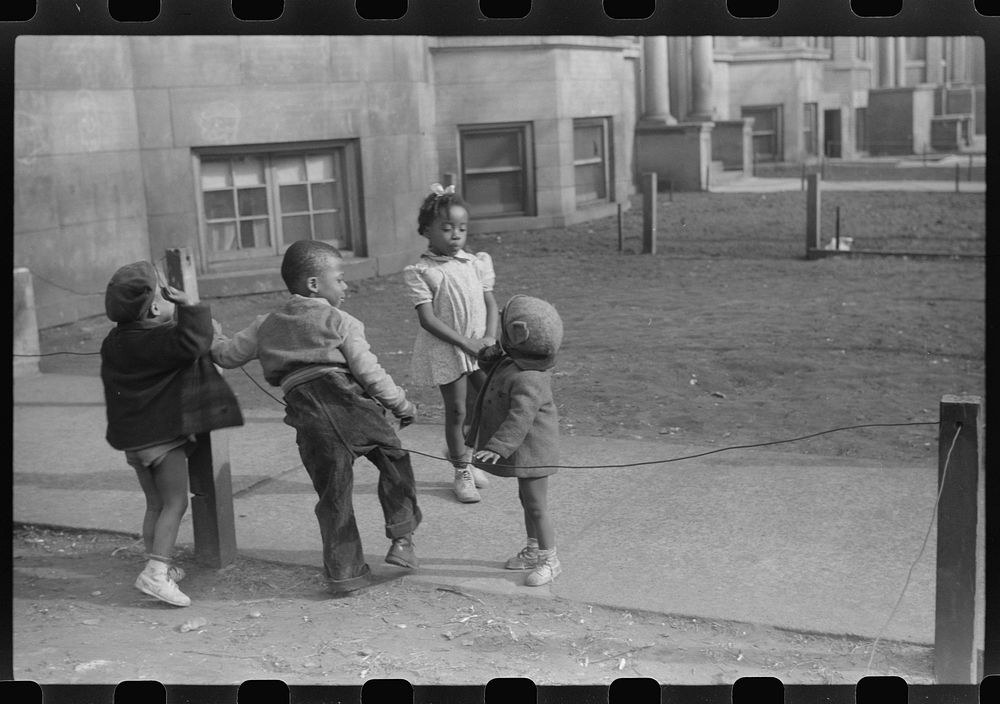 [Untitled photo, possibly related to: Children in front of apartment buildings in one of the better neighborhoods in the…