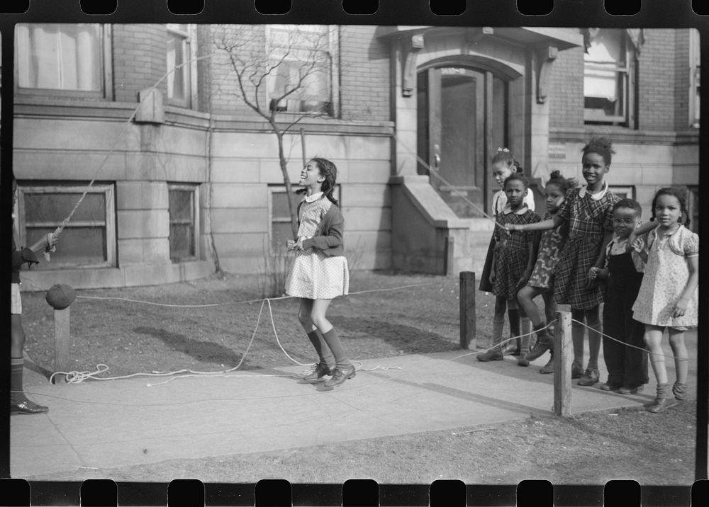 [Untitled photo, possibly related to: Jumping rope on sidewalk in one of the better neighborhoods of the Black Belt…