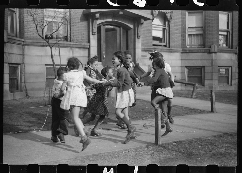 [Untitled photo, possibly related to: Jumping rope on sidewalk in one of the better neighborhoods of the Black Belt…