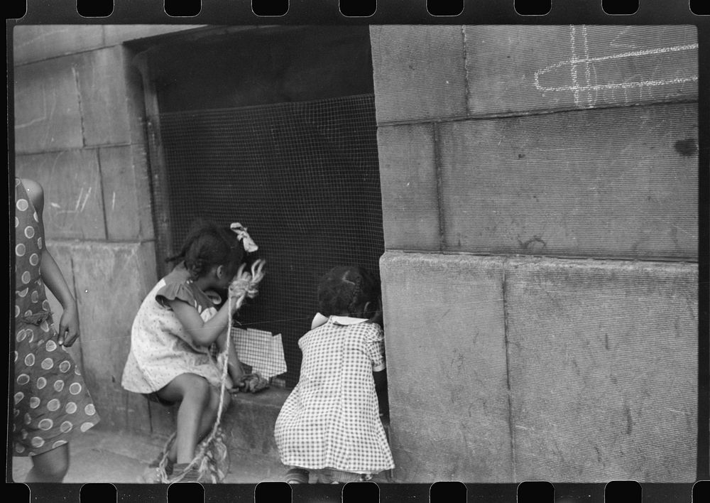 [Untitled photo, possibly related to: Children playing on the street, Chicago, Illinois]. Sourced from the Library of…