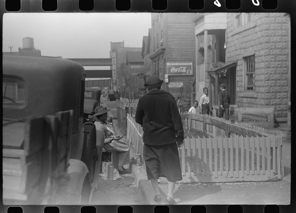 [Untitled photo, possibly related to:  woman painting the fence on her "pavement garden," Black Belt, Chicago, Illinois].…