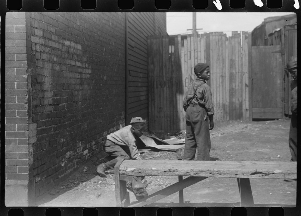 [Untitled photo, possibly related to: Children playing on the street, Black Belt, Chicago, Illinois]. Sourced from the…