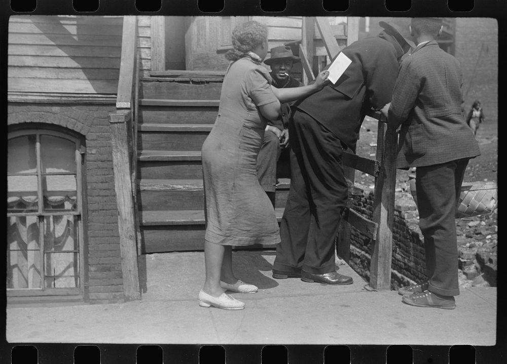 Conversation on the street, Black Belt, Chicago, Illinois. Sourced from the Library of Congress.
