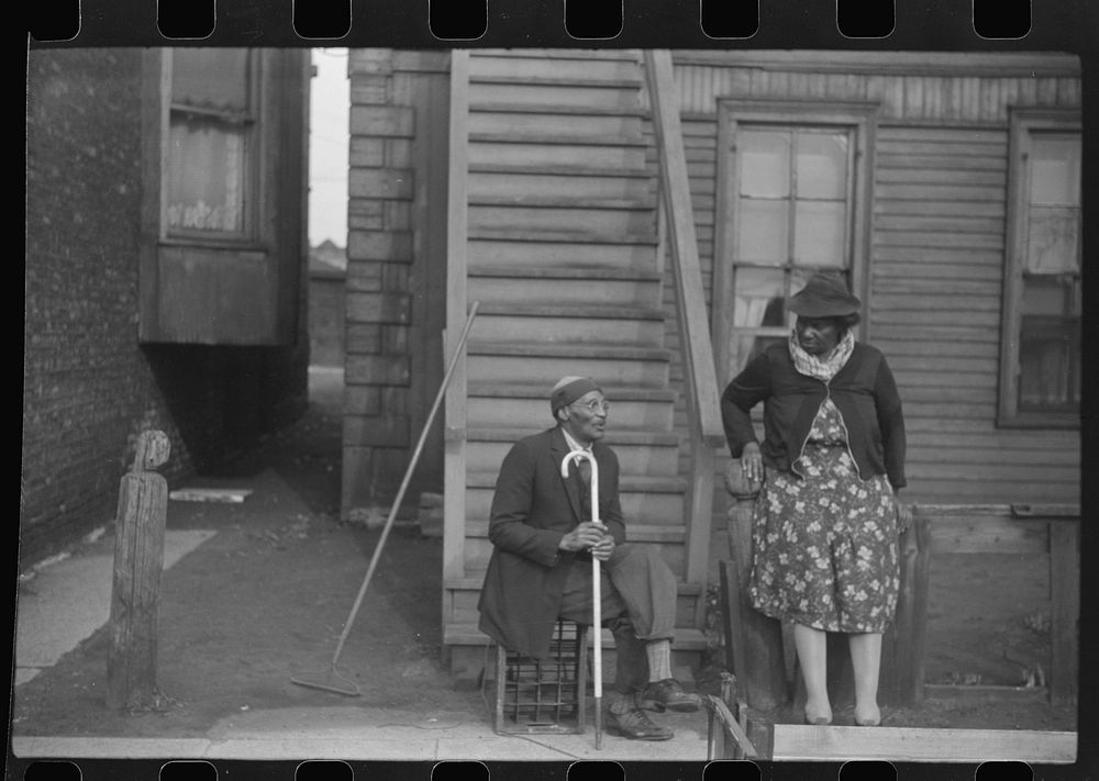 [Untitled photo, possibly related to: Sidewalk conversation, Black Belt, Chicago, Illinois]. Sourced from the Library of…