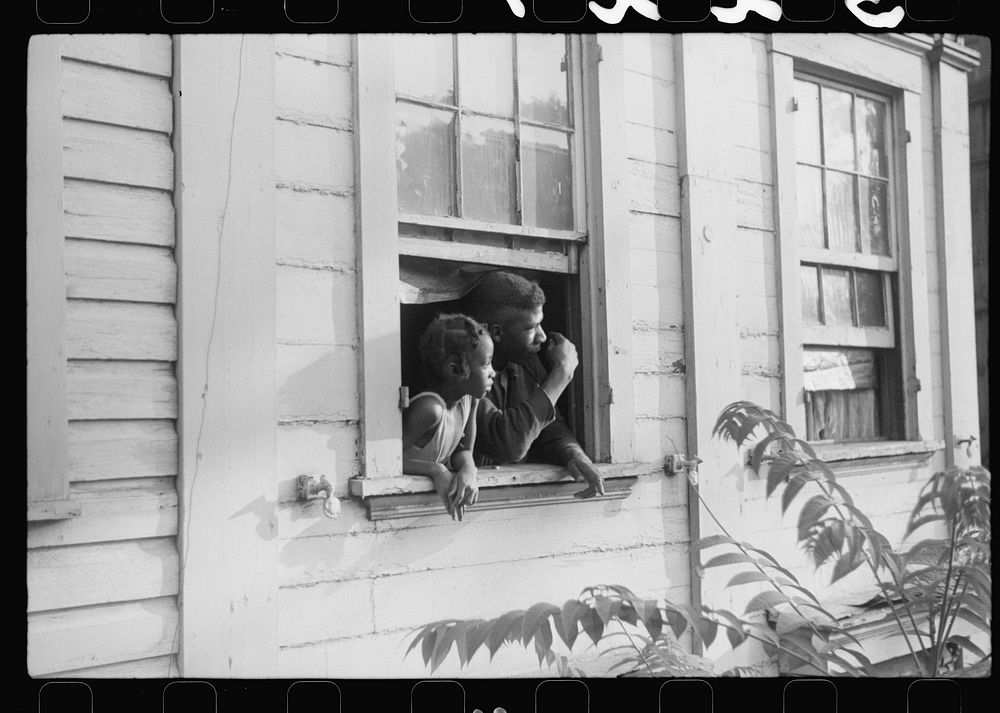 [Untitled photo, possibly related to: es looking out of their home, Washington, D.C.]. Sourced from the Library of Congress.