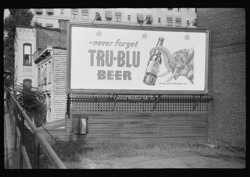 Advertising sign and  dwellings, Washington, D.C.. Sourced from the Library of Congress.