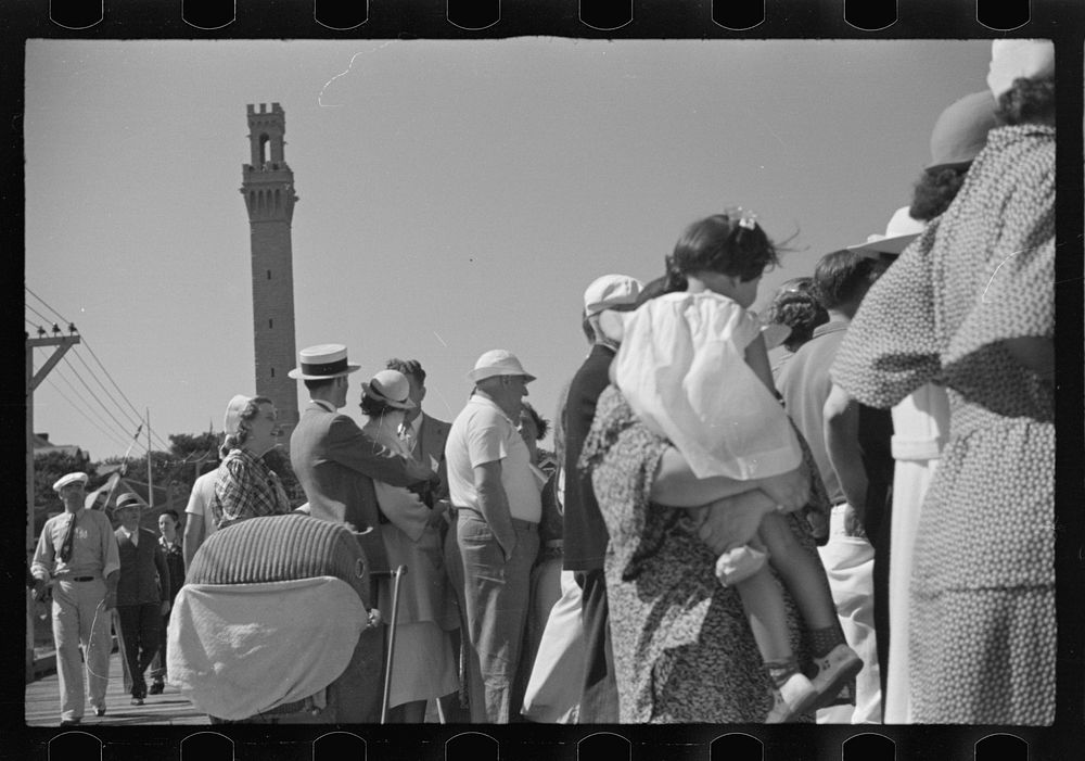 [Untitled photo, possibly related to: Summer residents watch the tourist boat arrive from Boston, Provincetown…