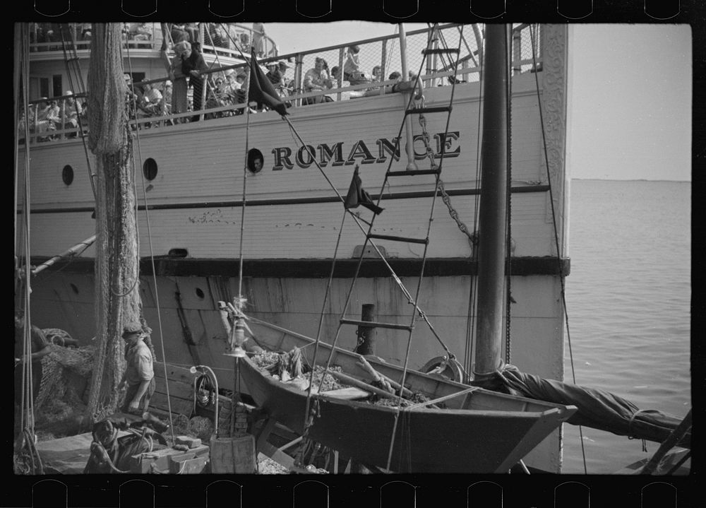 [Untitled photo, possibly related to: The economy of a town: fishing and the tourist trade. A fishing boat in front of the…