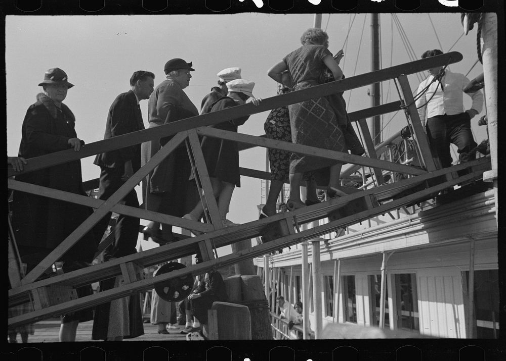 Tourists getting aboard the "Steel Pier" on their return trip to Boston. During the season two boats arrive daily at two…