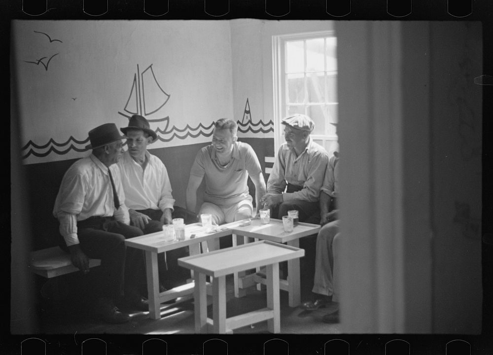 Fishermen and tourists mingle in tourist bar, Provincetown, Massachusetts. Sourced from the Library of Congress.