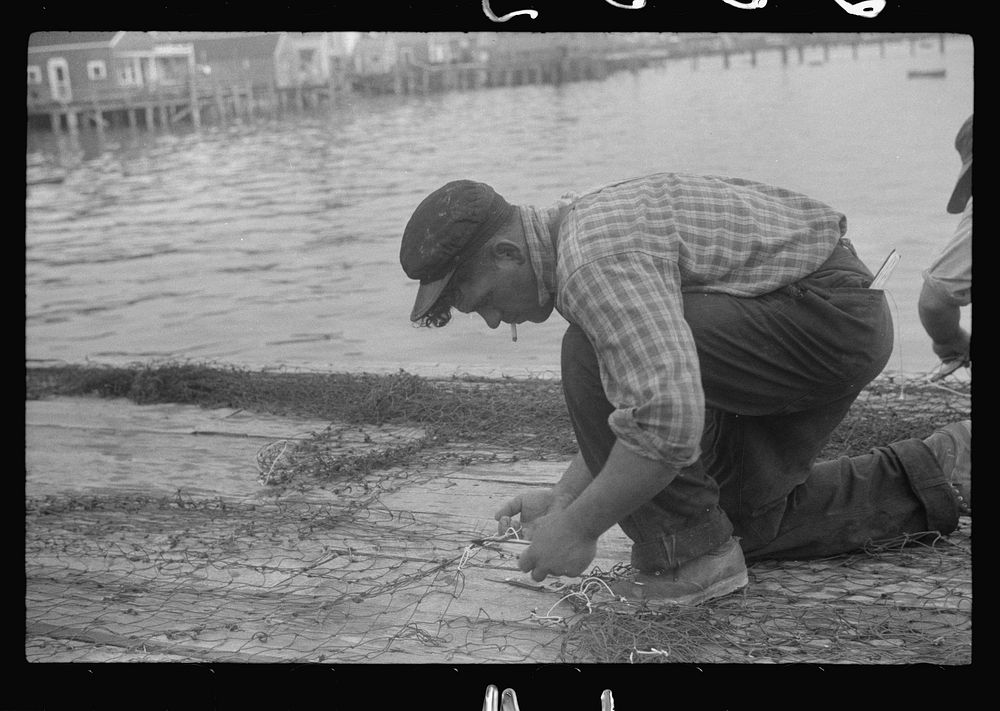 [Untitled photo, possibly related to: Fishermen repairing nets, Provincetown, Massachusetts]. Sourced from the Library of…