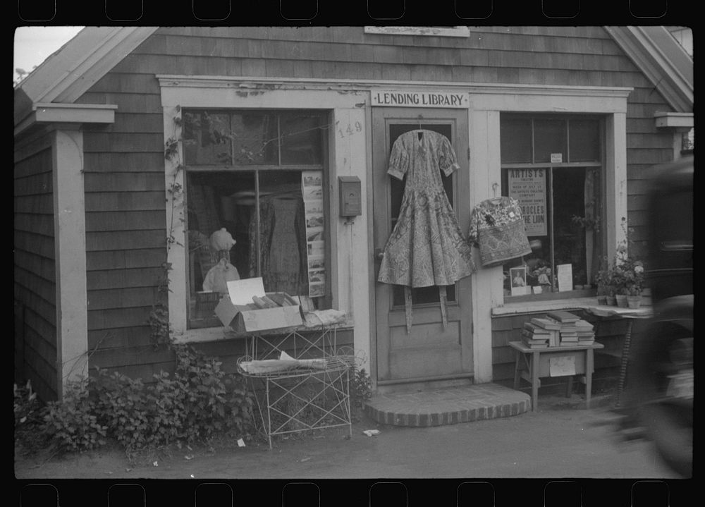 Shop front. Note dress on door which is "Provincetown dress," local specialty much favored by tourists, almost never worn by…