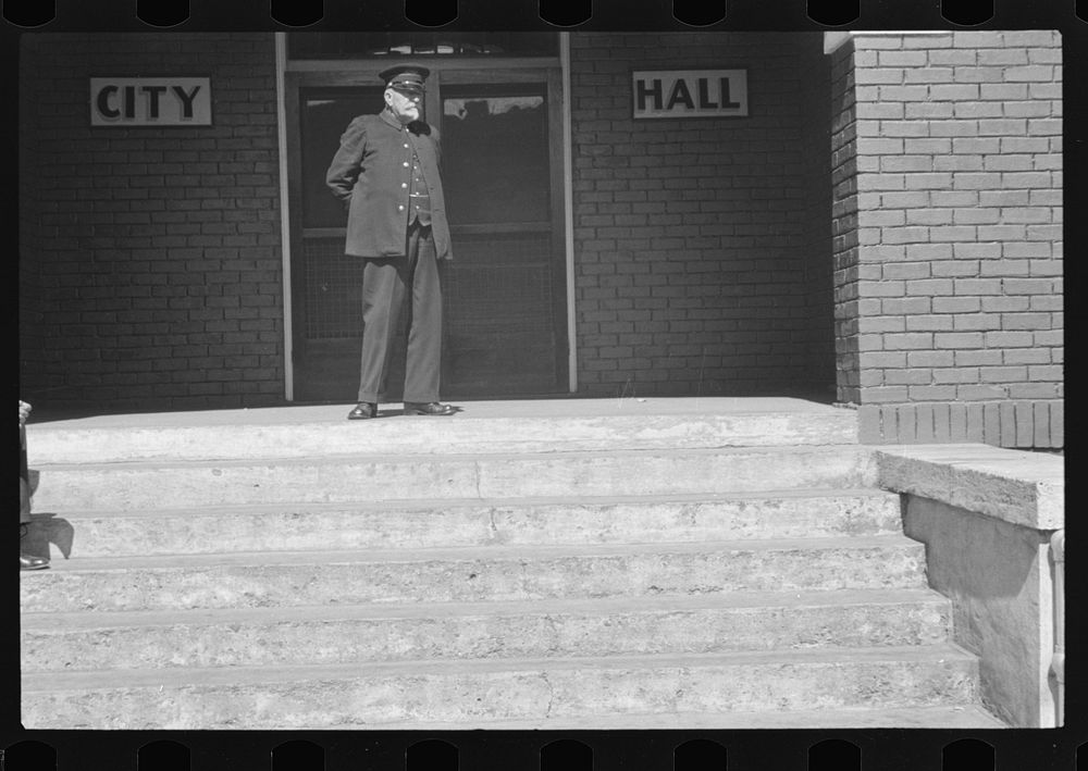 Old fireman in front of city hall, Maynardville, Tennessee. Sourced from the Library of Congress.